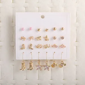 Set of 12 pairs of gold and pink earrings featuring stars, hearts and western motifs