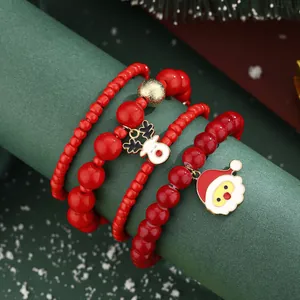 Festive red beaded bracelet set with Santa Claus and reindeer pendants for Christmas