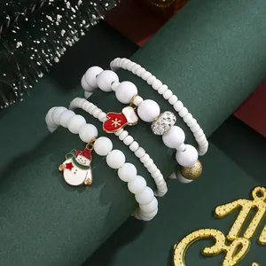 Christmas beaded bracelet set with snowflake snowman charms and red glove pendants