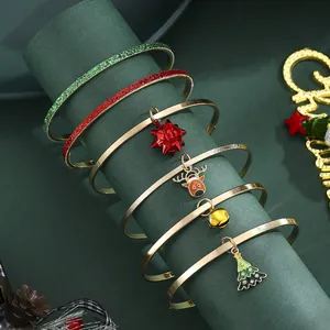 6-piece gold Christmas bangle set with reindeer, tree, and bell charms for holiday wear