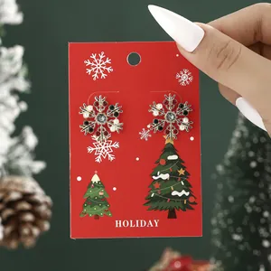 Christmas snowflake stud earrings with pearls and rhinestones on a holiday gift card