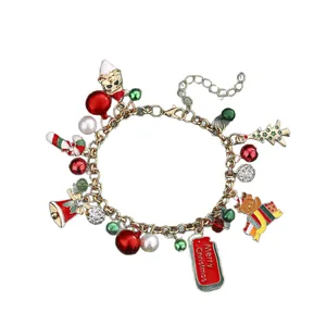 Christmas charm bracelet with Santa, reindeer, and enamel pendants on gold chain