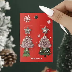 Christmas tree earrings with pink rhinestones and silver star on red holiday card