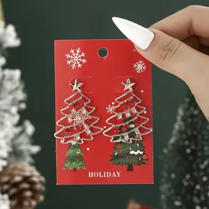 Christmas tree stud earrings with red white rhinestones and star on holiday card