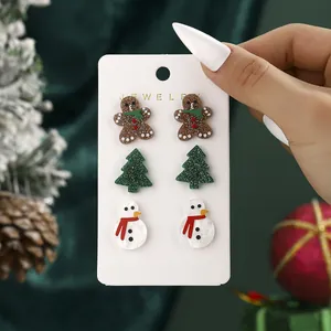 3-pair Christmas stud earring set featuring gingerbread man, tree, and snowman designs