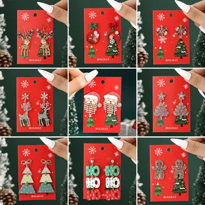 Christmas earrings set featuring reindeer, Santa Claus, and tree motifs with red gold finish