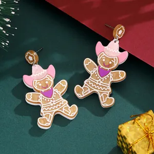 Cute gingerbread man earrings with pink cowboy hats and purple scarves for Christmas