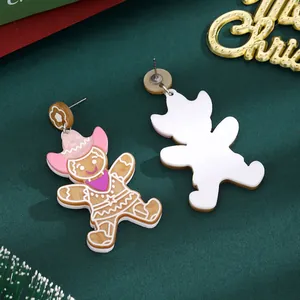 Cute Christmas Gingerbread Man earrings with pink cowboy hat and purple scarf detail