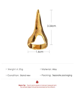 Detail view of punk style gold alloy nail ring with dimensions and textured surface