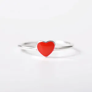 Elegant silver adjustable open ring featuring a vibrant red enamel heart charm
