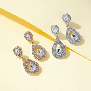 Elegant gold and silver drop earrings with pear-shaped cubic zirconia and pave rhinestones