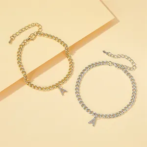 Sparkling crystal-encrusted letter A Cuban link anklet for women in gold and silver