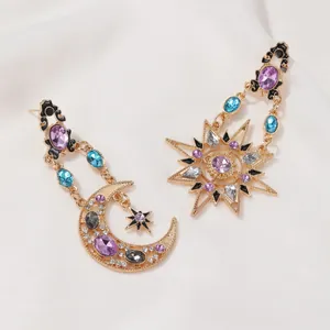 Baroque celestial long drop earrings with gold sun and moon mismatched crystal charms