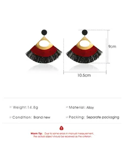 Detailed view showing 9cm by 10.5cm dimensions of gold hollow tassel earrings