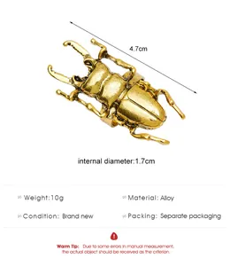 Detailed view of vintage gold cicada ring showing dimensions of 4.7cm in alloy material