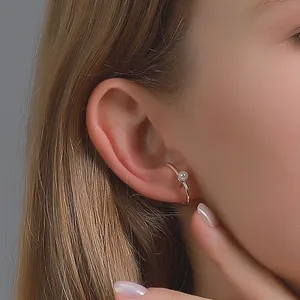 Elegant gold clip-on earring with a round white pearl for women without piercings