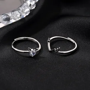 Romantic silver antler couple rings with round zircon on elegant black silk background