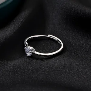 Macro shot of S925 sterling silver antler ring with round cubic zirconia on black silk
