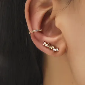 Gold ear cuff and stud set featuring colorful zircon stones in a trendy layered style
