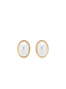 Macro detail of oval imitation pearl earrings with vintage gold bezel setting on white background