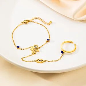 Set bracciale mano di Fatima dorato con occhio greco, cristalli blu e anello unito