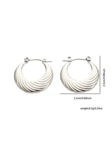 Detailed view of silver hoop earrings showing irregular wave texture and size dimensions