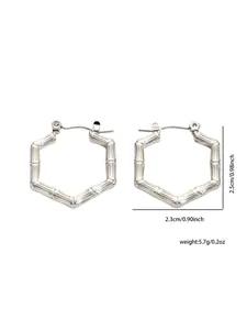 Detail view of silver titanium steel earrings with bamboo texture and dimensions