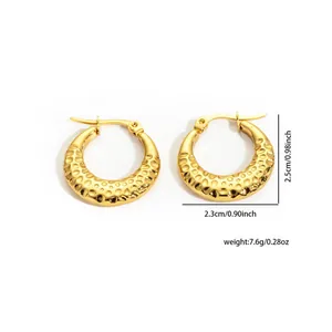 Golden textured stainless steel hoop earrings with unique hammered dot pattern design