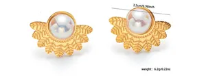 Macro detail of golden leaf earrings with pearls and size measurements for jewelry