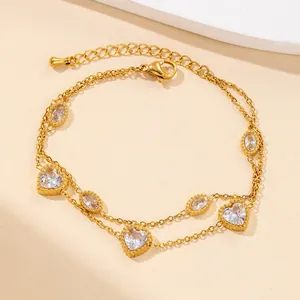 Double-layered gold stainless steel bracelet with heart and oval zircon stone charms