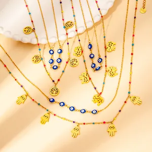 Gold-plated stainless steel charm necklaces with evil eye and tree of life pendants