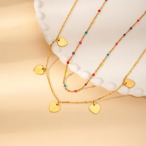 Gold-plated stainless steel layered necklace featuring colorful beads and heart pendants