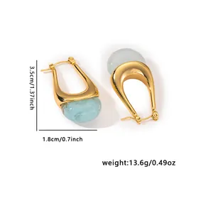 Golden U-shaped earrings with light blue translucent stones and precise measurements