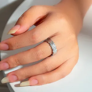 Detailed close-up of a silver stainless steel open ring with intricate woven texture