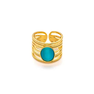 Multilayer gold stainless steel open ring featuring a blue oval gemstone with cat eye effect