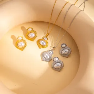 Elegant gold and silver heart-shaped jewelry sets with oval pearls and beaded frames