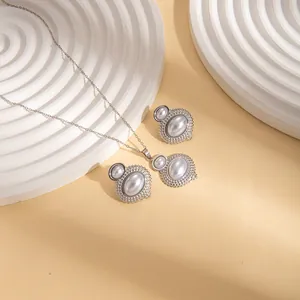 Elegant titanium steel gourd jewelry set with white pearls and silver beaded edge finish