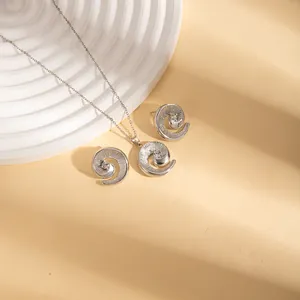 Elegant stainless steel jewelry set featuring spiral pendant necklace and matching stud earrings
