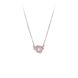 Elegant rose gold baby footprints necklace with sparkling zircon pavé for women