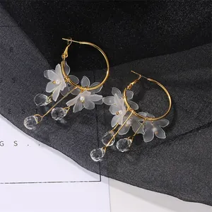 Elegant gold hoop earrings with matte petals, pearls and crystal drop tassels