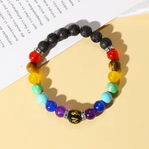 Macro shot of colorful seven chakra volcanic stone bracelet with silver spacer beads