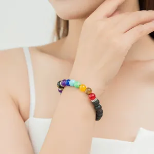 Ethnic 7 chakra volcanic stone beaded bracelet featuring colorful frosted mineral stones