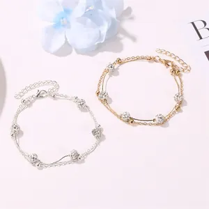 Double-layered Shamballa crystal ball anklet in gold and silver finish with adjustable chain