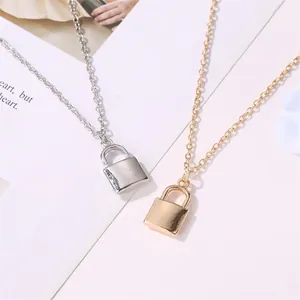 Minimalist polished metal solid padlock pendant necklaces in gold and silver finishes