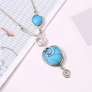 Bohemian ethnic necklace with silver alloy snail motifs and cracked turquoise pendants
