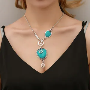 Bohemian ethnic necklace with turquoise stones and vintage silver metal pendants