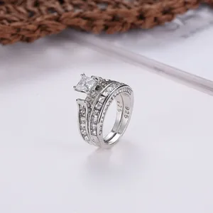 Detailed side view of two-piece bridal ring set with large princess cut cubic zirconia stone