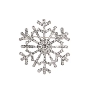 Élégante broche flocon de neige avec cristaux étincelants sur base argentée