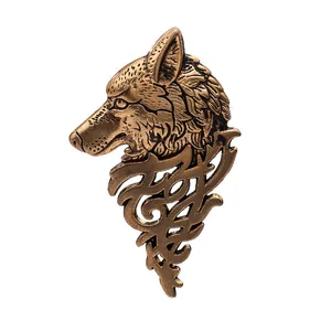 Vintage bronze wolf head lapel pin with textured metal finish and tribal details