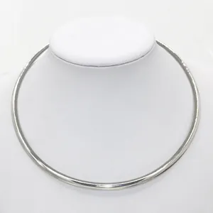 Polished silver punk metal choker necklace displayed on a white jewelry mannequin
